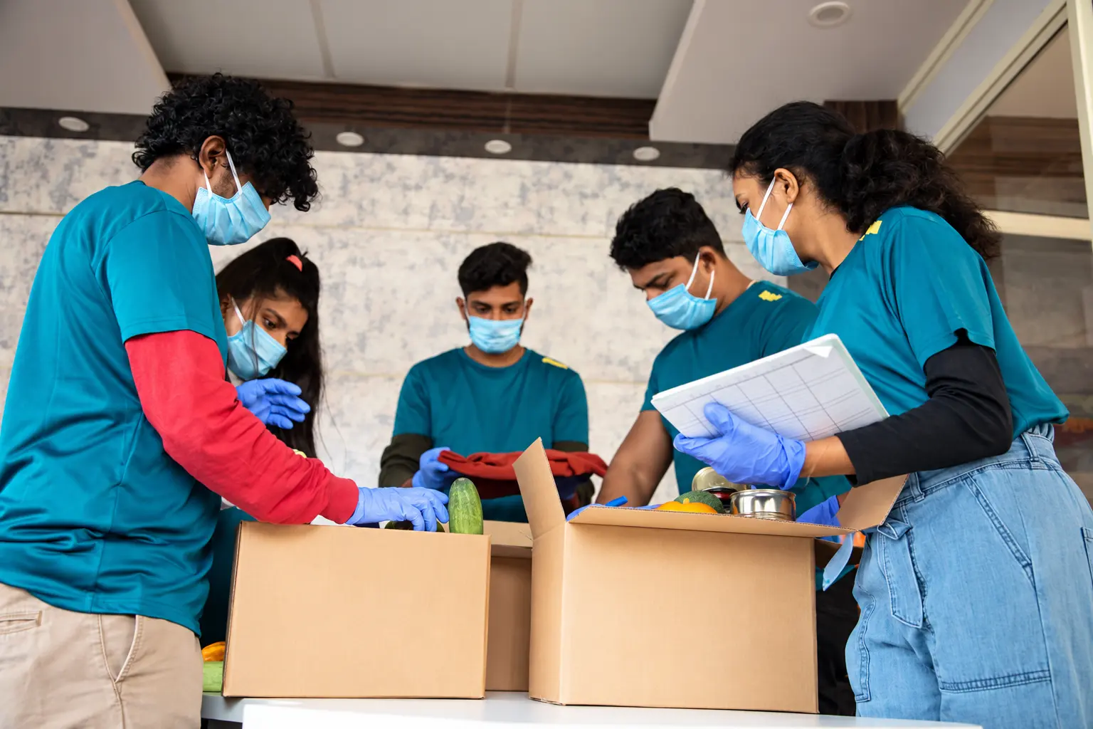 Volunteers packing community donations